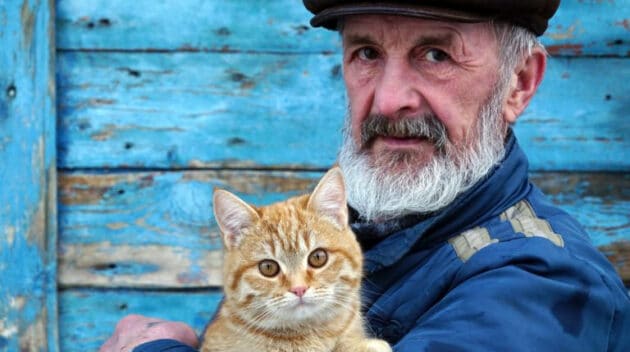 A man holding a cat.