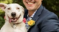 man holding a happy dog.